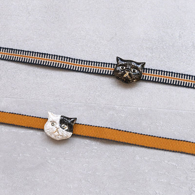 【ニコアンティーク 帯締め＋帯留め 2点セット】ぶち猫　黒猫 真田紐 四分紐 飾り紐 国産 着付け小物（5389625001）